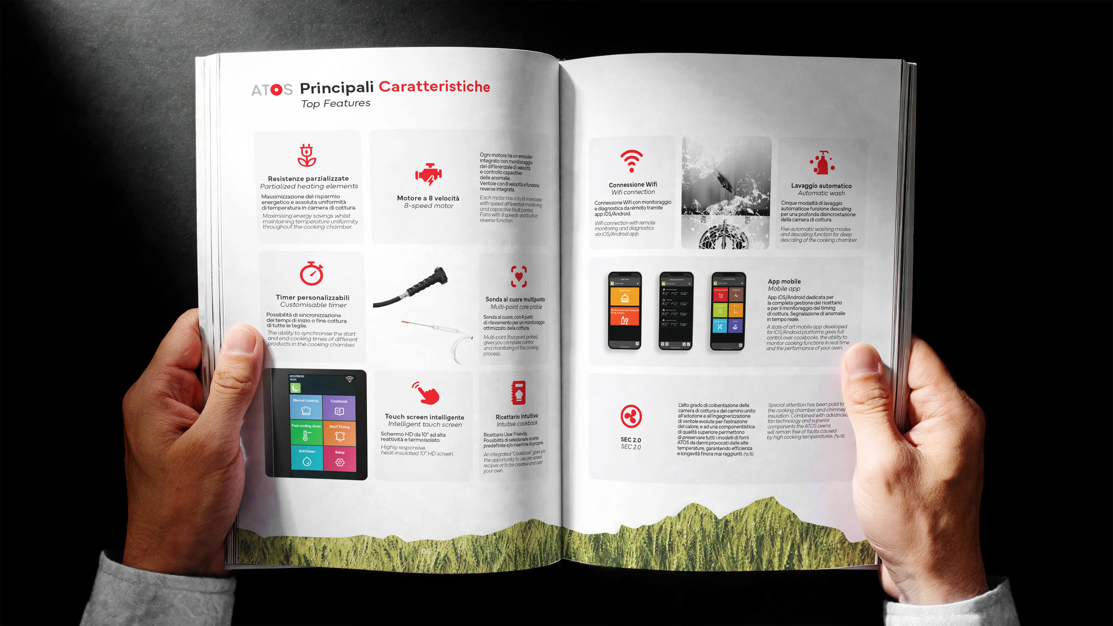 Open catalogue held by two hands featuring top features of a product with icons and text in Italian and English, including partialized heating elements, 8-speed motor, WiFi connection, automatic wash, customizable timer, multi-point core probe, intelligent touch screen, intuitive cookbook, mobile app, and SEC 2.0 certification.