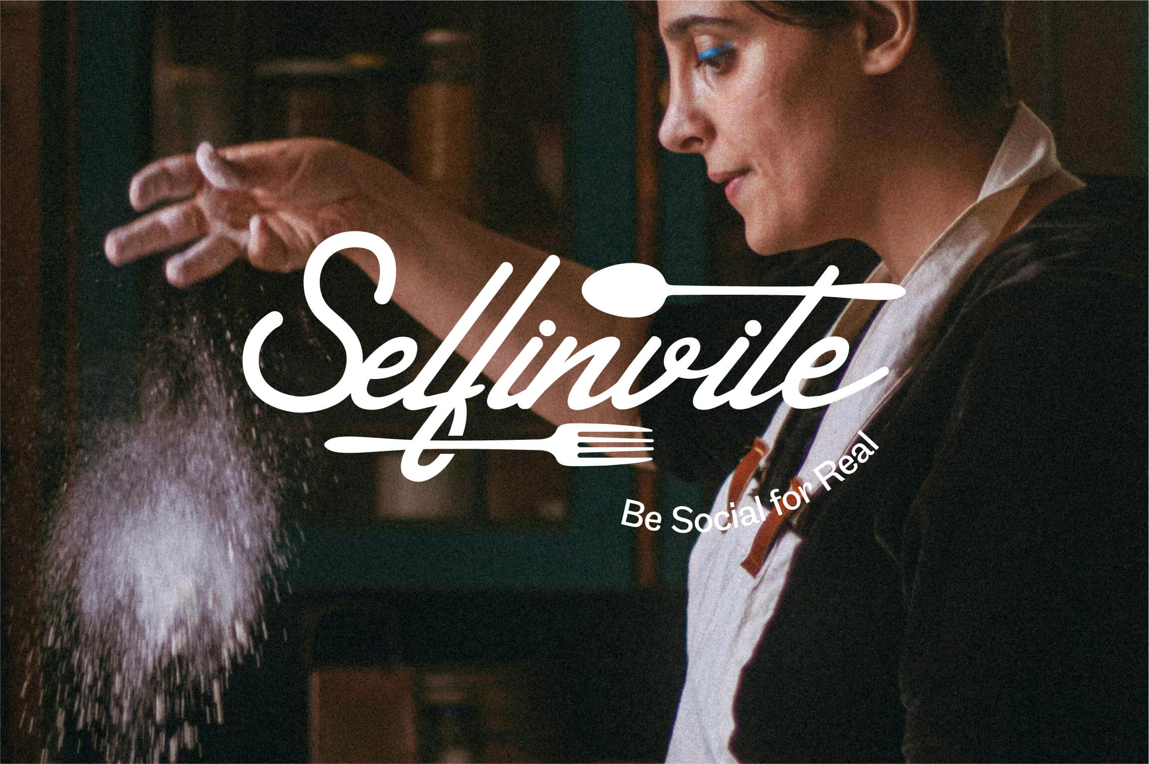 Woman in a kitchen sprinkling flour or powdered ingredient from her hand, wearing a black top and a white apron, with the logo text "Selfinvite" and tagline "Be Social for Real" overlaid.